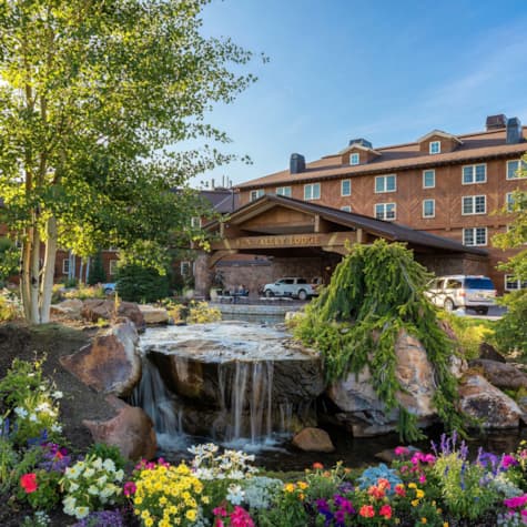 svr_lodge_exterior_summer_pond_flowers